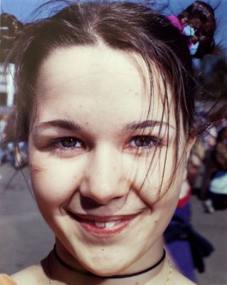 Smiling Girl 1 100 € / UNTITLED, NUORET SANKARIT / YOUNG HEROES, 1995-1996, 60,5 x 50 cm, print size 37 x 29,5 cm, c-print black metal frames + glass, ed. 1/10