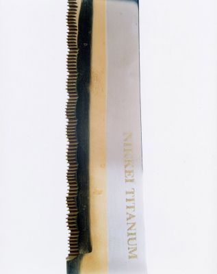 Blades: A Dark-handled Nikkei Titanium 6 000 € / Finnish view - fragments of our time, 2002-2004, 155 x 125 cm, c-print diasec, signed, ed. 1/6 "A man slashed his wife's hand '02"