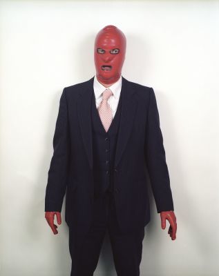 Man with a red latex mask 5 600 € / End of innocence / Viattomuuden loppu, 135 x 110 cm, c-print, mounted on aluminum, wooden frames + glass, ed. 1/6